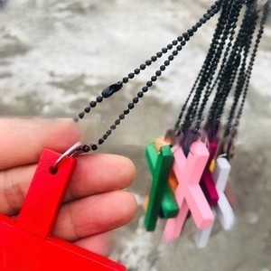 Minimalist wooden cross pendant necklace with colorful matte finish and black bead chain