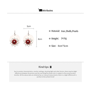 Detail view showing red floral earring dimensions 8x5cm with shell and pearl materials