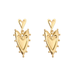 French vintage heart shaped gold earrings with textured dot edges and layered design