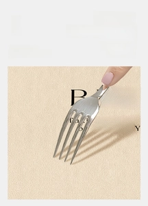 Close-up of scratch-resistant beige coffee mat being tested with a metal fork
