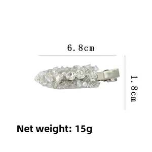 Detail showing dimensions of sparkling rhinestone and pearl leaf-shaped hair clip