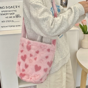 Detail of plush pink heart tote bag showing the soft texture and one-piece fuzzy strap