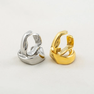 Minimalist fluid irregular adjustable ear cuffs in polished gold and silver metal finishes