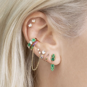 S925 silver needle emerald and crystal tassel earrings set on female model's ear