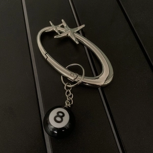 Silver metal oval carabiner keychain with stars and black billiard number 8 ball charm