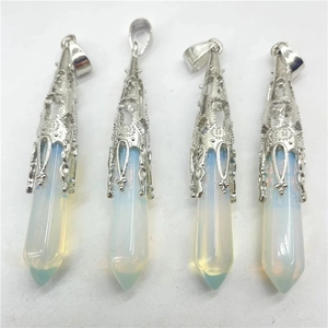 Detail of four hexagonal opal pendants with vintage silver filigree metal caps