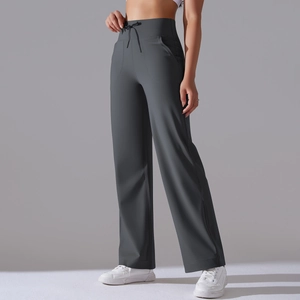 Detail of high waist drawstring athletic pants with functional side curved pockets