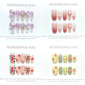 Handmade cat-eye press-on nails featuring floral and heart designs in a 4-style set