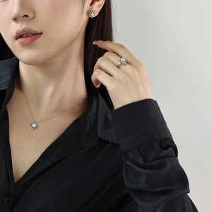 Macro view of S925 sterling silver jewelry set featuring heart zircon necklace and earrings