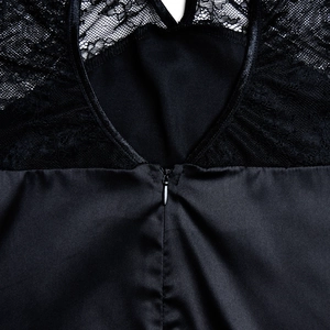 Detailed view of the back lace stitching and invisible zipper on the black long dress
