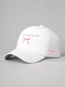 Detail of pink ribbon print and I'm literally just a girl slogan on white cotton cap