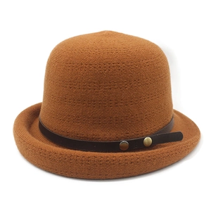 Caramel brown knit bucket hat with leather strap and metal buttons for women