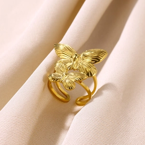 Macro detail of adjustable butterfly ring with gold plating and textured wings