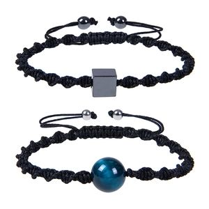 Detail showing two-piece adjustable woven bracelets with black and blue stones