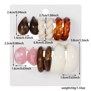Detailed set of 6 acrylic earrings with measurements and weights in a studio layout
