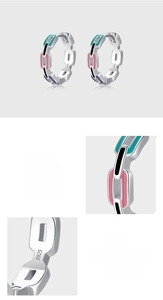 Detailed macro view of S925 sterling silver stamp and colorful enamel on geometric hoop earrings