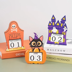 Detail of wooden Halloween countdown calendar showing pumpkin and ghost castle designs