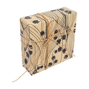 Three rolls of vintage kraft wrapping paper featuring black lily of the valley floral patterns