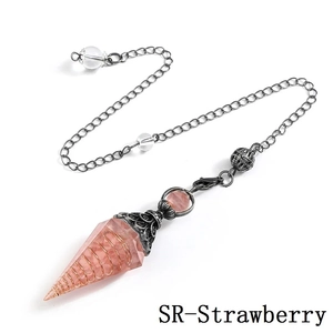 Detail of pink strawberry crystal pendulum with wire wrapping and antique silver finish chain