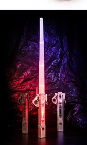 Detail of pink LED laser sword with retractable blade and metallic mechanical handle
