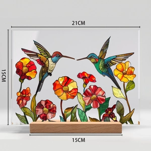 Detail view of hummingbird and floral acrylic ornament with size 21x15cm and wooden base