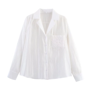 Women's white long-sleeve casual shirt with floral embroidery on the chest pocket