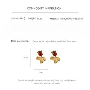 Detailed view of amber resin goldfish earrings with dimensions of 4cm by 3cm