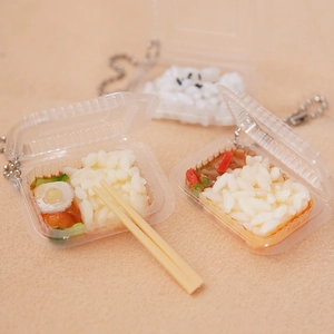 Miniature disposable lunch box keychain featuring realistic stir-fry beef and rice model