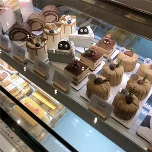 Close-up of tiered dessert display featuring chestnut cream and blueberry cheesecake