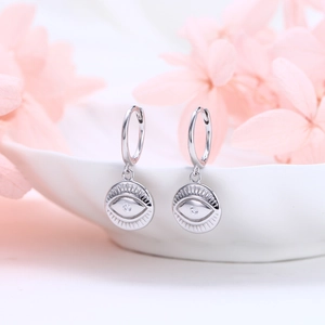 Elegant S925 sterling silver evil eye drop earrings with white zircon on white porcelain