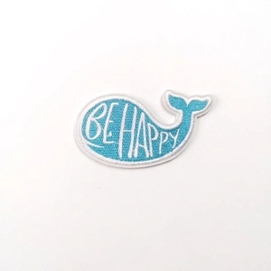 Blue whale cartoon embroidered patch with Be Happy text and heat seal backing