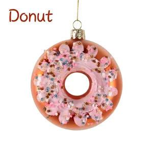 Detailed view of pink 10cm glass donut ornament with colorful beads for Christmas tree
