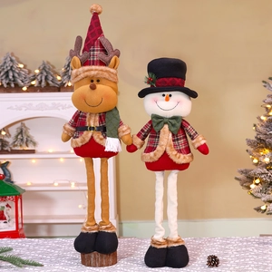 Detailed view of plush reindeer and snowman Christmas dolls with telescopic legs and plaid outfits