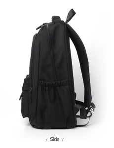 Side view of multi-layer black backpack with honeycomb breathable straps and side pockets