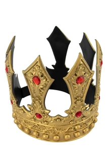 Detailed relief carving on a vintage gold king crown with large red gemstone inlays