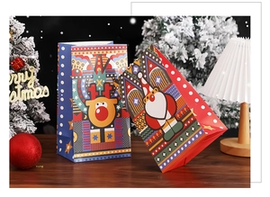 Detailed view of colorful Christmas gift bags featuring Santa and reindeer illustrations
