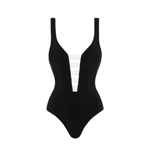 Detail of deep V-neckline with white mesh stripes on a black one-piece swimsuit