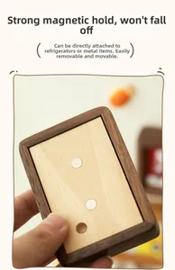 Detail of black walnut wood photo frame with strong magnets on the back for fridge