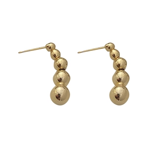 Minimalist gold-tone curved bead stud earrings with five graduated metallic spheres