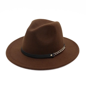 Detail of wool felt fedora featuring black leather band with gold studs and metal chains