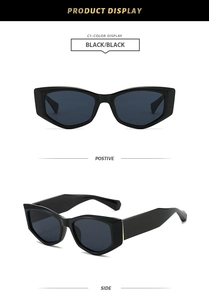 Close-up of retro black cat-eye sunglasses with thick glossy frames and dark lenses