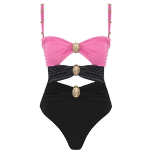 Detail of pink and black monokini with gold buckle accents and side cut-outs