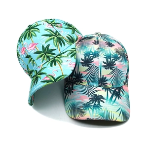 Detail of tropical palm and flamingo print baseball caps with adjustable curved brims
