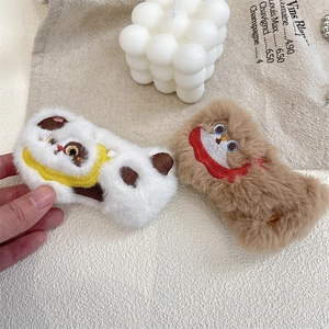 Detail of plush monster brooches with delicate embroidery for bag and clothes DIY