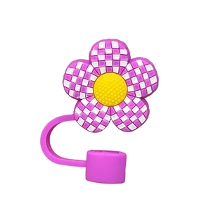Detail view of 10mm purple floral silicone straw cover with yellow center and plaid pattern