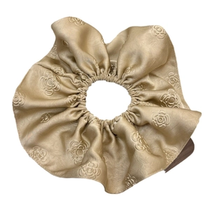 Champagne gold jacquard satin scrunchie with elegant camellia floral relief pattern