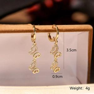 Detail showing dimensions of gold butterfly earrings with zircon inlay for jewelry size guide