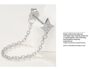 Macro view of S925 sterling silver star stud earring with shimmering zircon inlay