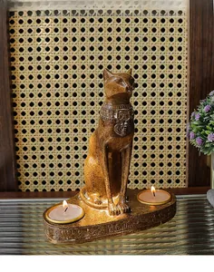 Detail of Bastet Egyptian cat candle holder with bronze texture and hieroglyphs