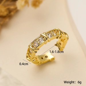 Macro detail of 18K gold plated geometric X-ring with size 1.6-1.8cm and 6g weight